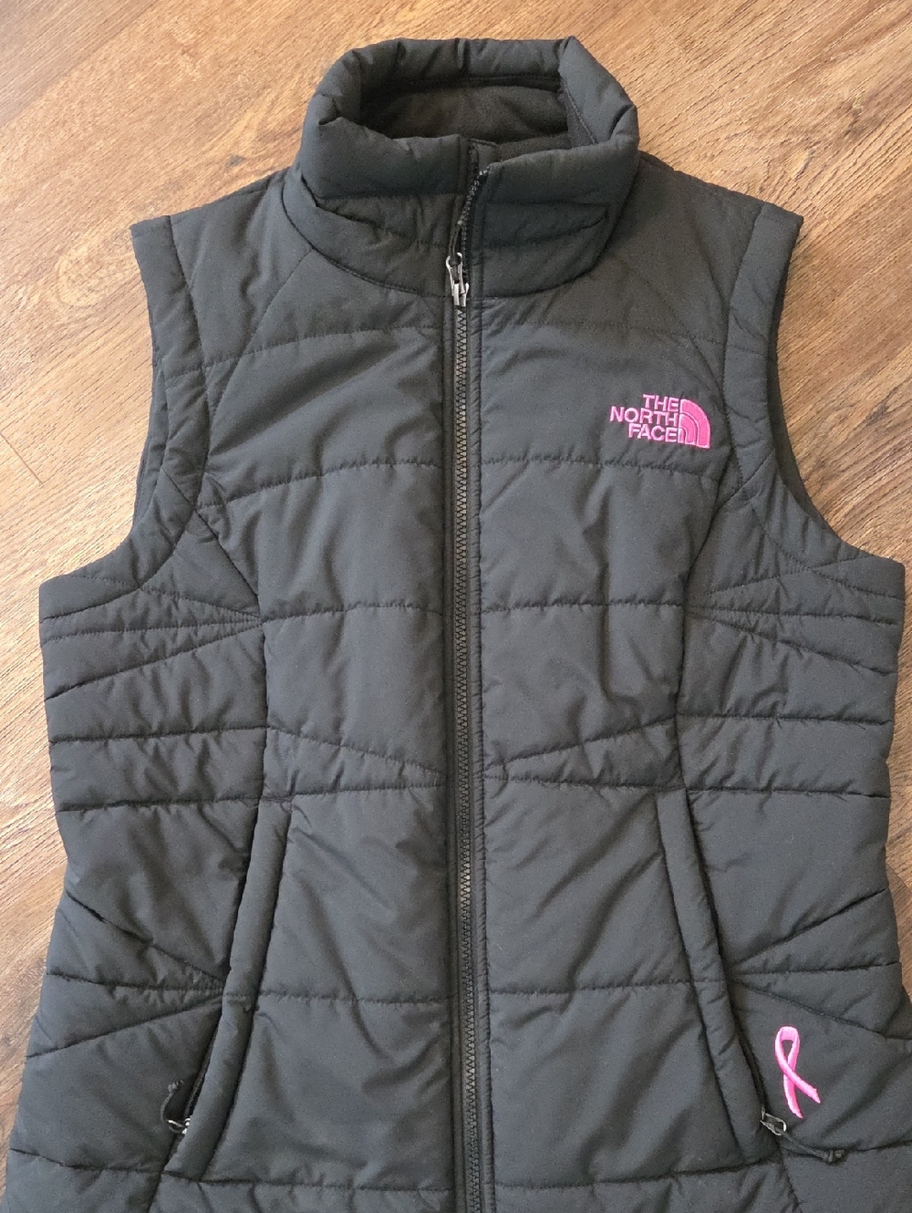 The North Face Black Puffer Vest with Pink Logo